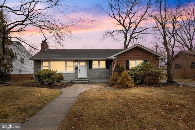 view of front of home with a yard