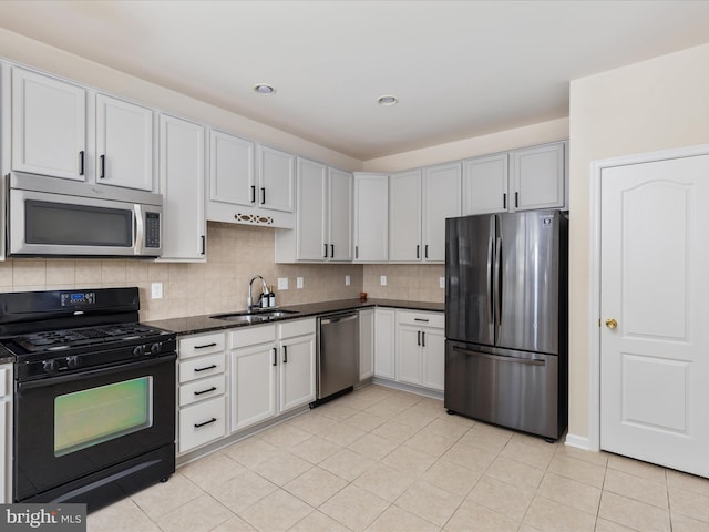 kitchen with sink, white cabinetry, backsplash, stainless steel appliances, and light tile patterned flooring