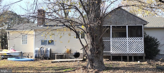 rear view of house with a sunroom