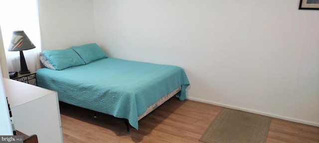 bedroom featuring hardwood / wood-style flooring