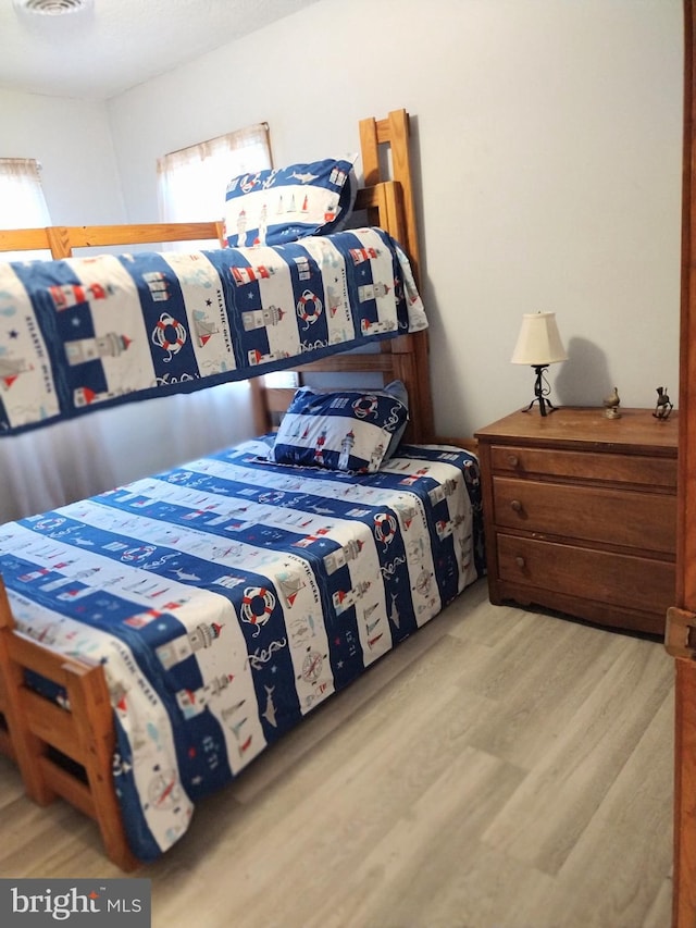 bedroom with light wood-type flooring