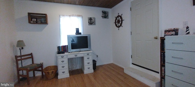 interior space with light hardwood / wood-style floors and wooden ceiling