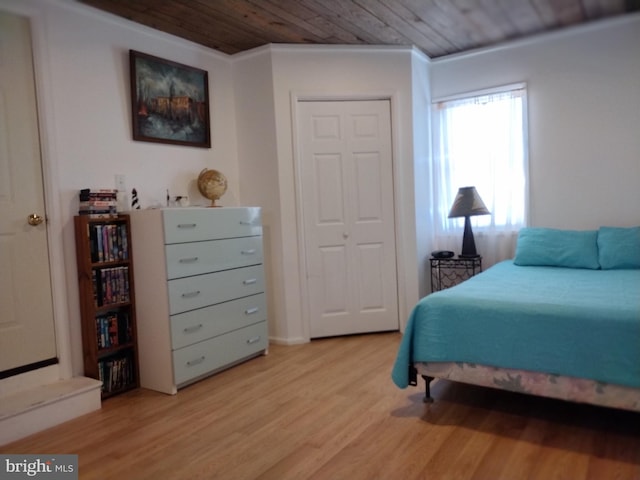 bedroom featuring wooden ceiling and light wood-type flooring