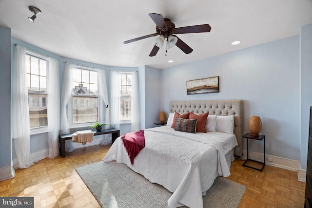 bedroom featuring ceiling fan and light parquet flooring