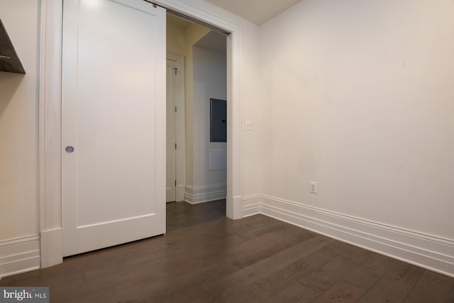 unfurnished bedroom with dark hardwood / wood-style floors