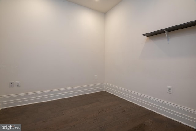 unfurnished room featuring dark hardwood / wood-style floors