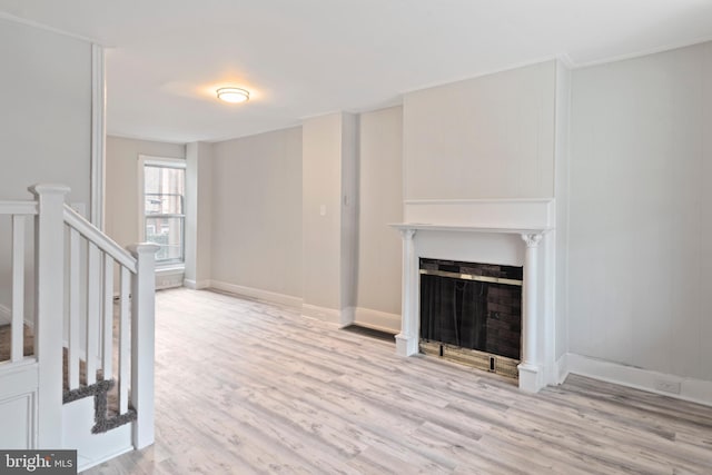 unfurnished living room featuring light wood-type flooring