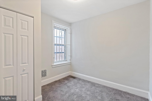 empty room with carpet flooring