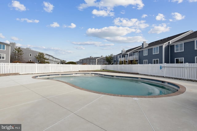 view of swimming pool with a patio area