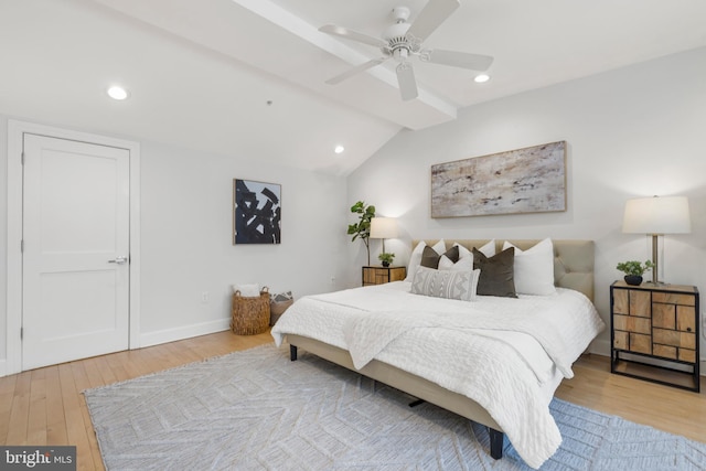 bedroom with vaulted ceiling with beams, ceiling fan, and light wood-type flooring