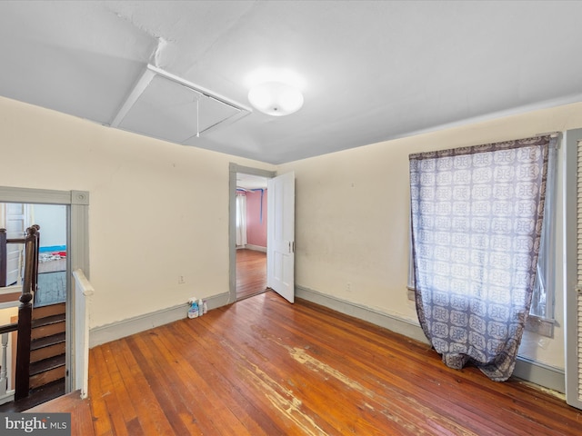 unfurnished room featuring wood-type flooring