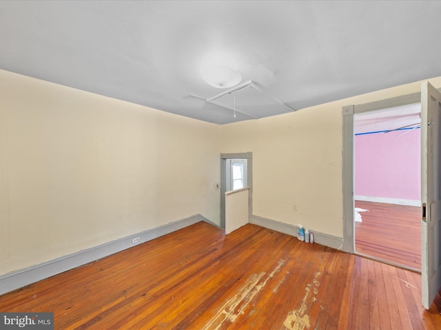 unfurnished room featuring wood-type flooring