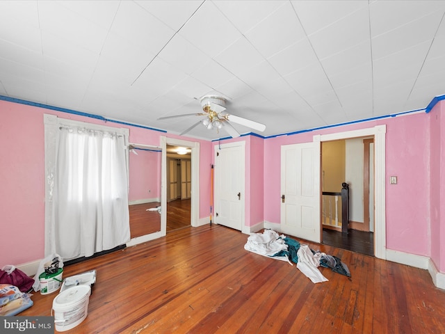 unfurnished bedroom featuring hardwood / wood-style flooring and ceiling fan