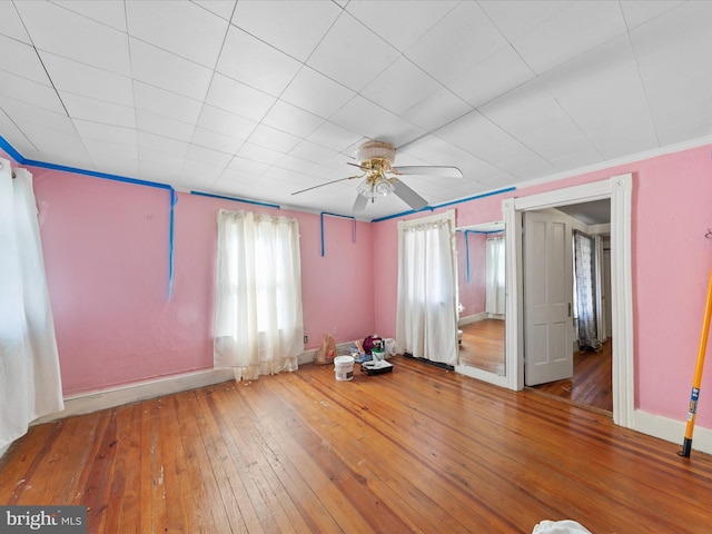 interior space featuring hardwood / wood-style flooring and ceiling fan