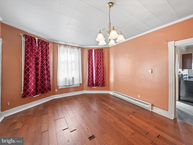 unfurnished dining area with crown molding, wood-type flooring, a chandelier, and baseboard heating