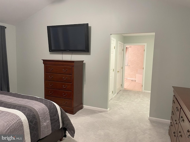 carpeted bedroom featuring lofted ceiling