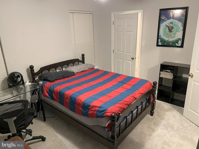 bedroom with light colored carpet