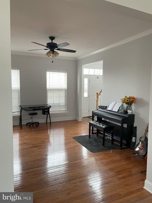 miscellaneous room featuring wood-type flooring, ornamental molding, and ceiling fan