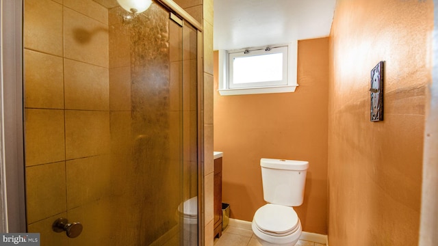 bathroom with tile patterned flooring, an enclosed shower, and toilet