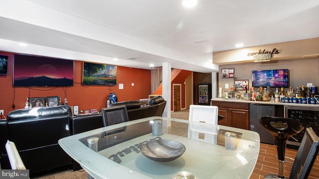 dining area featuring wine cooler, bar area, and light hardwood / wood-style floors