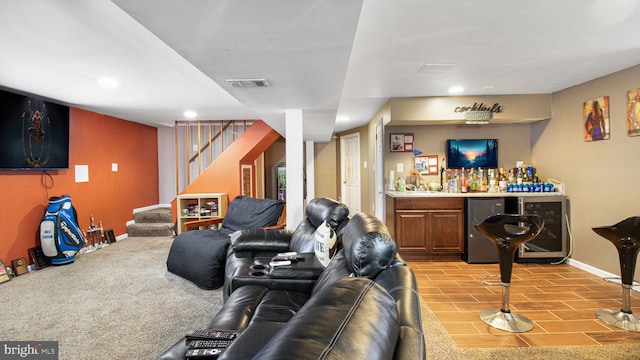 living room featuring bar area and beverage cooler