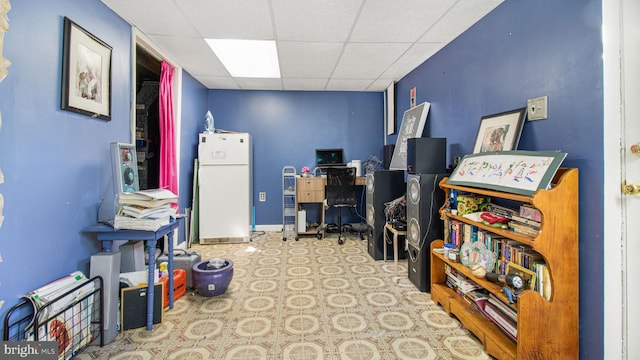 interior space featuring a drop ceiling