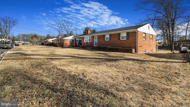 view of property exterior with a yard