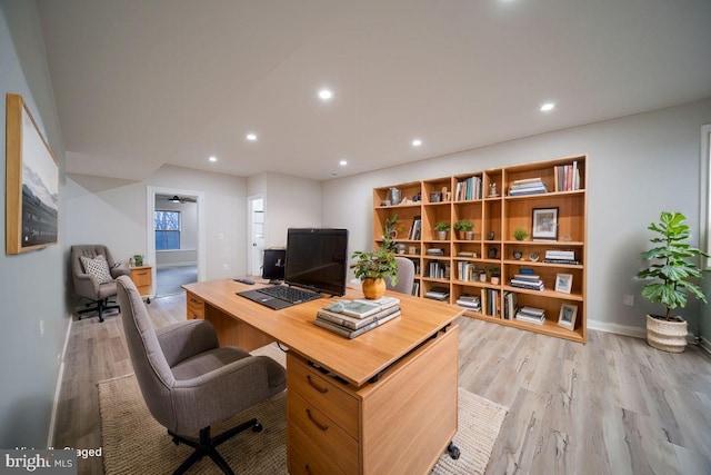 home office with light wood-style floors, baseboards, and recessed lighting