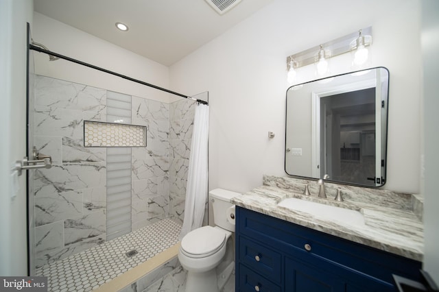 full bathroom featuring marble finish floor, a shower stall, visible vents, and vanity