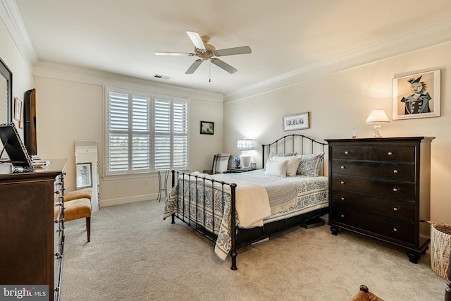 carpeted bedroom featuring crown molding and ceiling fan