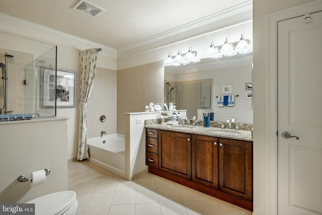 full bathroom featuring crown molding, tile patterned flooring, tiled shower / bath combo, vanity, and toilet