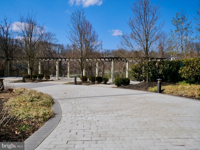 view of home's community featuring a pergola