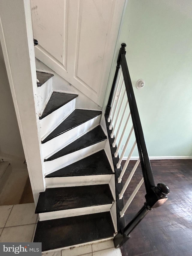 staircase featuring hardwood / wood-style floors