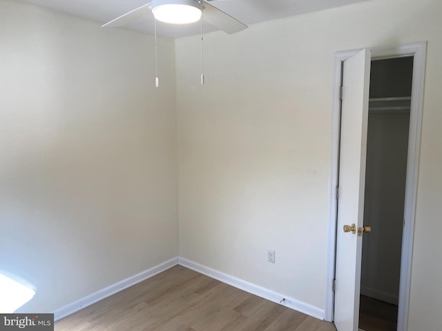 unfurnished room featuring hardwood / wood-style floors and ceiling fan