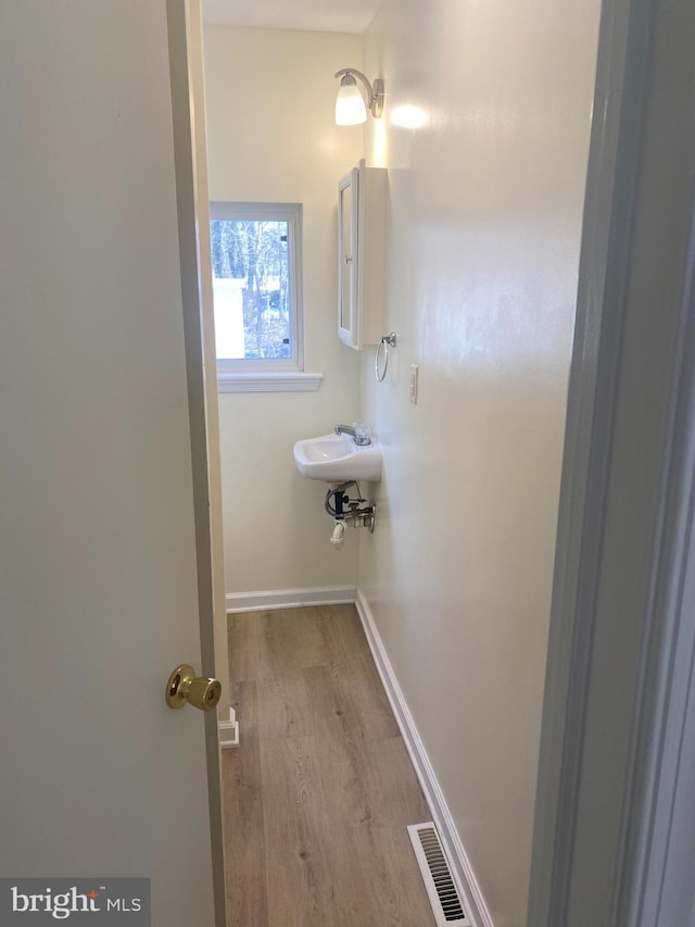 bathroom featuring hardwood / wood-style floors and sink