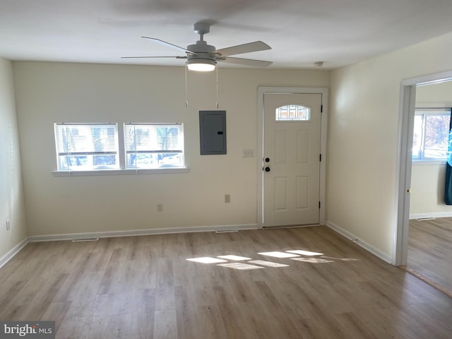 entryway featuring ceiling fan, electric panel, and light hardwood / wood-style floors