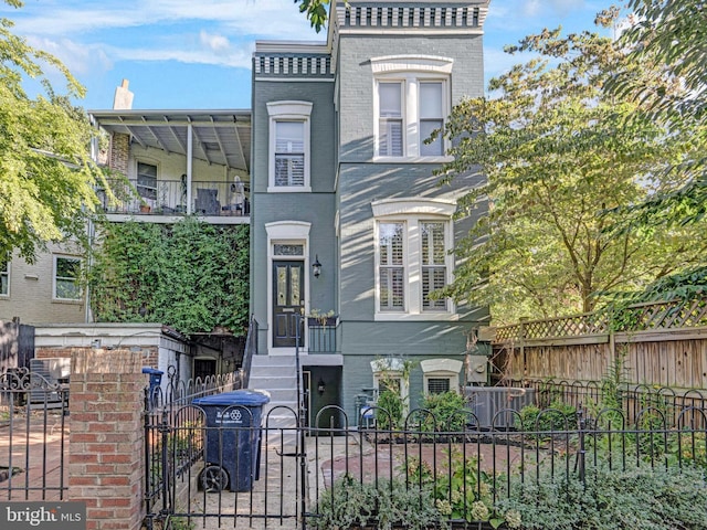 view of front of house featuring a balcony