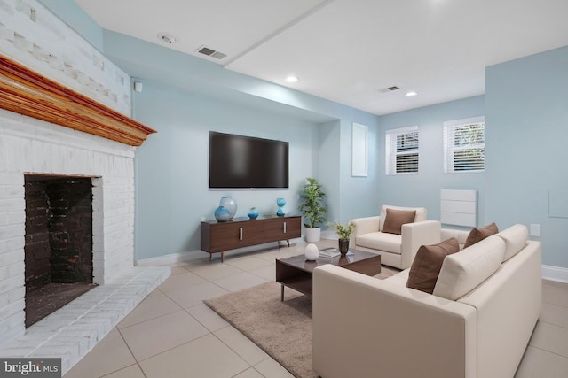 living room featuring light tile patterned flooring and a fireplace