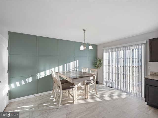 dining area with a notable chandelier