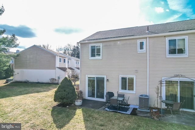 back of property featuring a patio, a yard, and central air condition unit