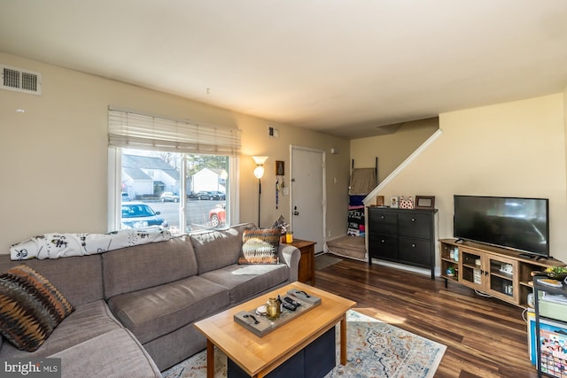 living room with dark hardwood / wood-style flooring