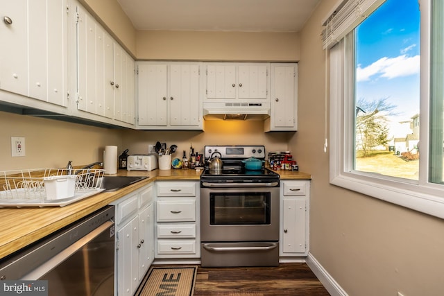 kitchen with dark hardwood / wood-style floors, white cabinetry, wooden counters, dishwashing machine, and stainless steel electric range