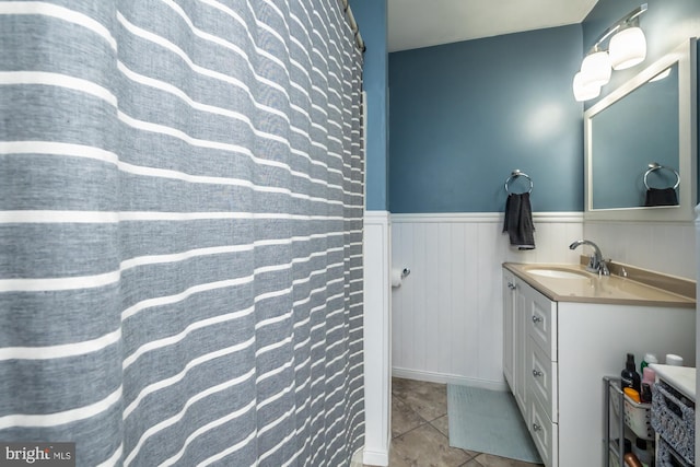 bathroom featuring tile patterned flooring and vanity