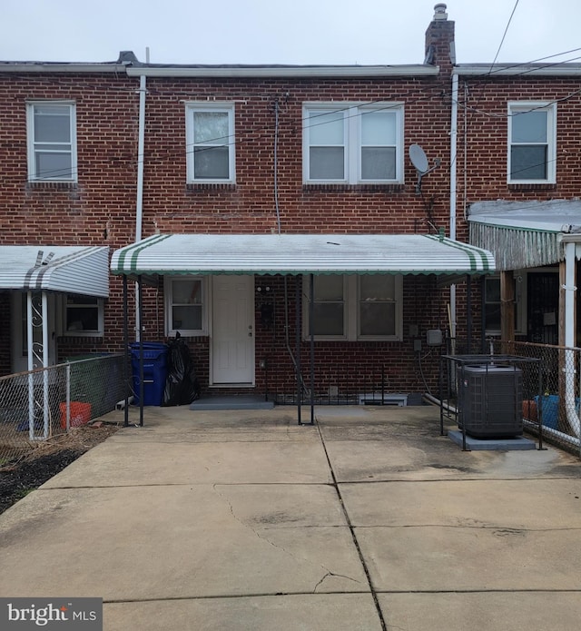 view of property featuring central AC unit