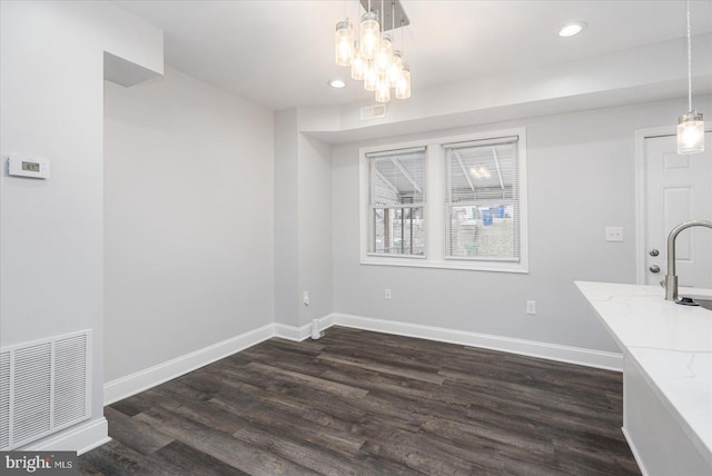 dining area with dark hardwood / wood-style flooring