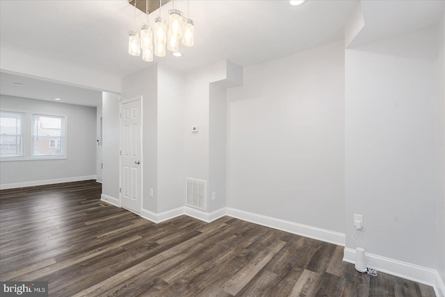 spare room featuring dark hardwood / wood-style floors