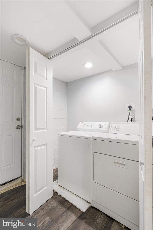 laundry area with washing machine and clothes dryer and dark hardwood / wood-style floors