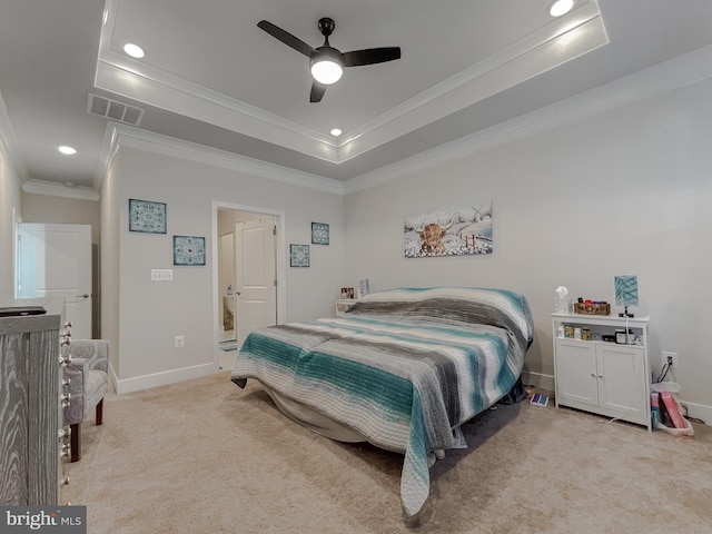 carpeted bedroom featuring crown molding, ceiling fan, and a tray ceiling