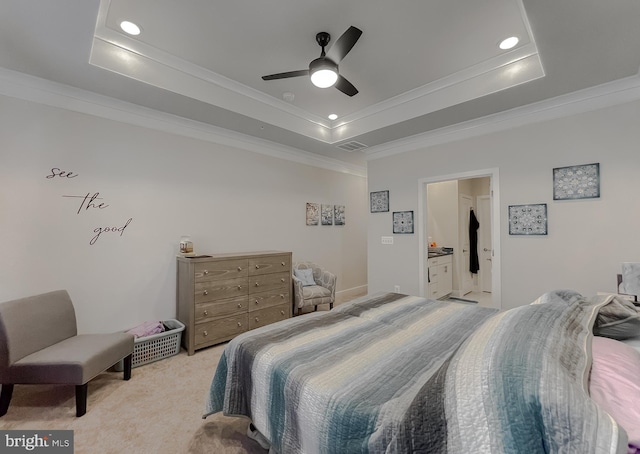 bedroom featuring crown molding, ceiling fan, a tray ceiling, and light carpet