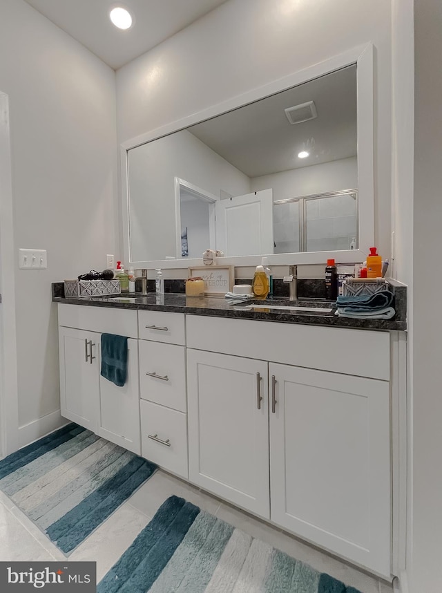 bathroom featuring vanity and walk in shower